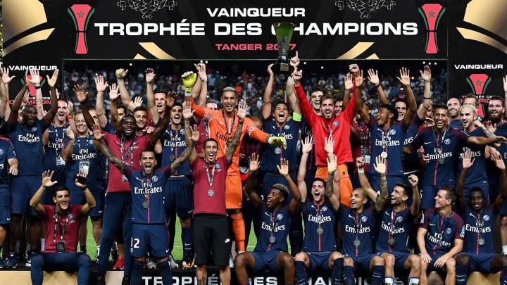 Paris Saint-Germain's Brazilian defender Thiago Silva (C) holds the trophy as he celebrates with teammates after winning the French Trophy of Champions (Trophee des Champions) football match between Monaco (ASM) and Paris Saint-Germain (PSG) on July 29, 2017, at the Grand Stade in Tangiers.