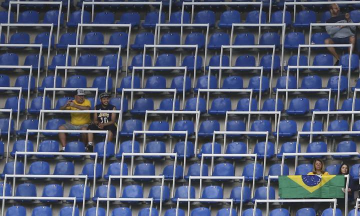 Olympics kicks off to empty seats as organisers left red faced