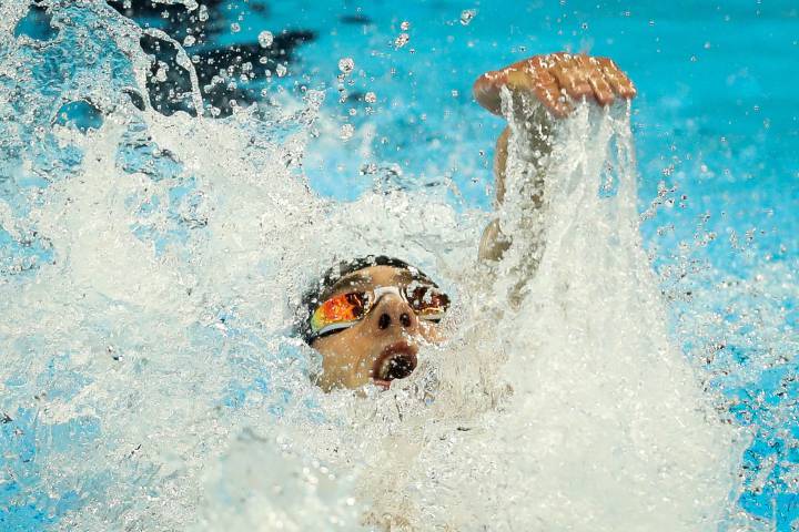 Phelps augments legend status; Simone Manuel makes history