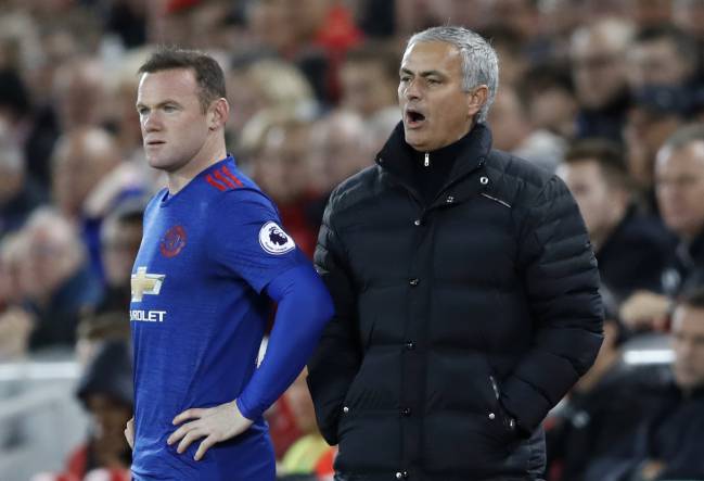 As Wayne Rooney prepares to comes on is Jose Mourinho yelling orders or yawning?
