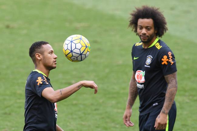 Brazil's players Neymar and Marcelo take part in a training session ahead of their game with Argentina.