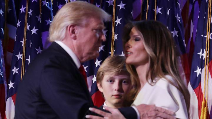 Republican president-elect Donald Trump embraces his wife Melania Trump