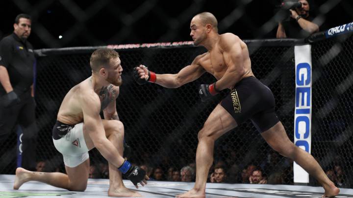Conor McGregor fights Eddie Alvarez in their lightweight title bout during UFC 205