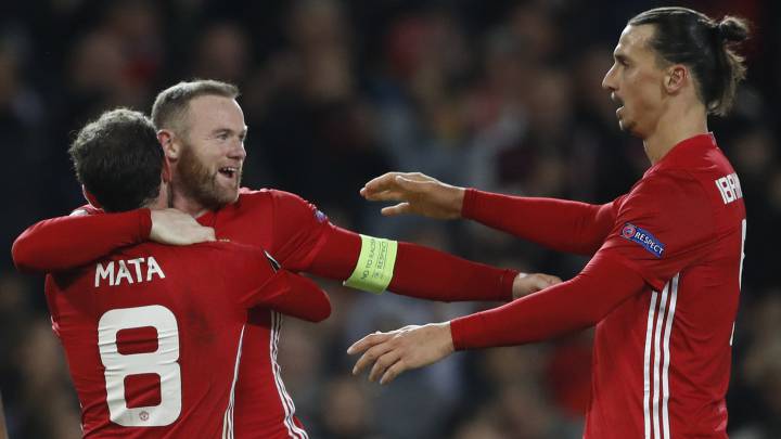 Manchester United's Juan Mata celebrates scoring their second goal with Wayne Rooney and Zlatan Ibrahimovic.