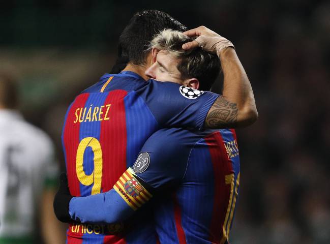 Barcelona's Lionel Messi and Luis Suarez