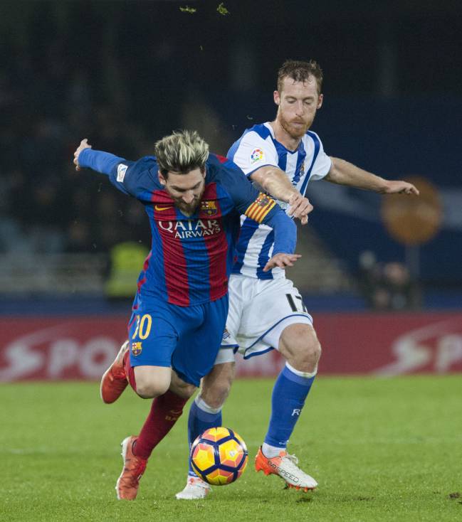 Messi picked himself up after this grimacing and holding his knee.