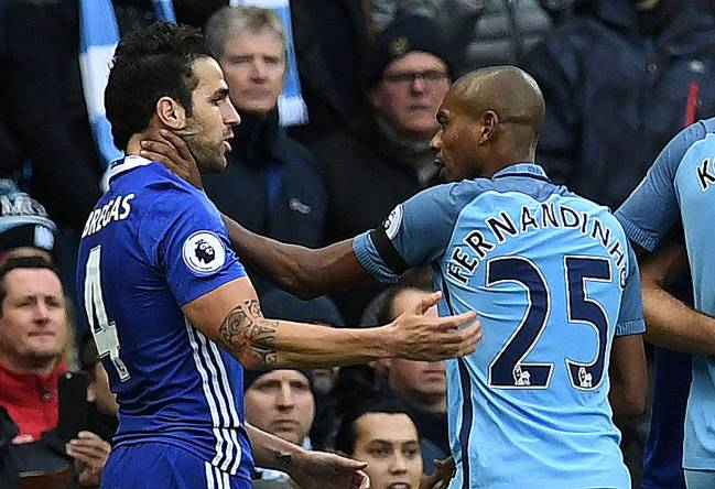 Manchester City's Brazilian midfielder Fernandinho saw red after this reaction to Chelsea's Spanish midfielder Cesc Fabregas.