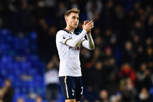 Christian Eriksen of Tottenham Hotspur shows appreciation to the fans