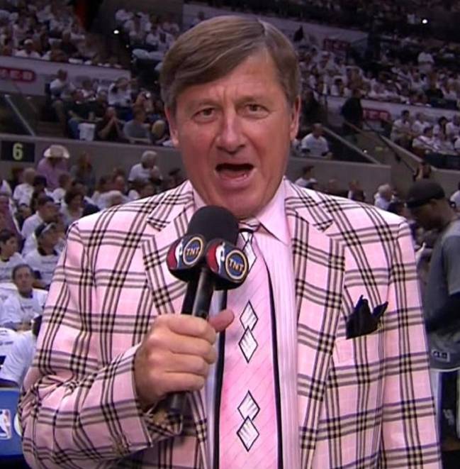 craig Sager wearing a pink number during a game.