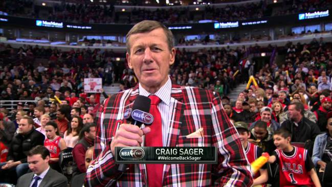 Craig Sager at a Chicago Bulls game wearing the red, black and white plaid.