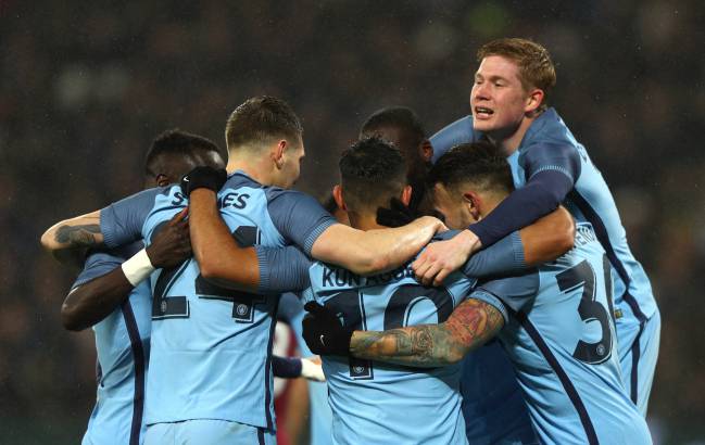 Sergio Aguero of Manchester City celebrates with team mates after scoring his sides fourth goal during The Emirates FA Cup Third Round match