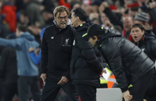 Liverpool manager Juergen Klopp remonstrates with the fourth official after Chelsea are awarded a penalty