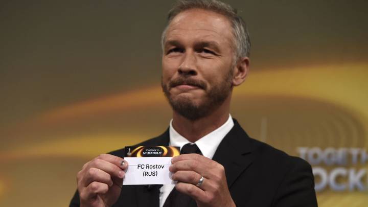 Europa League final ambassador Patrik Andersson shows the name of Rostov during the draw for the round of 16 of the UEFA Europa League