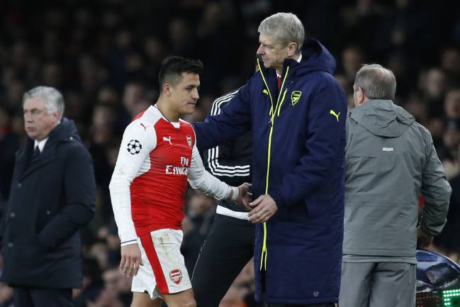 Arsenal's French manager Arsene Wenger greets Arsenal's Chilean striker Alexis Sanchez after he is substituted