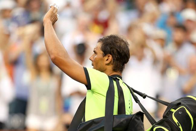 Disappointed | Rafael Nadal of Spain leaves the court after losing to Roger Federer.
