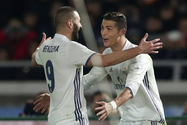 Ronaldo and Benzema celebrate a goal.