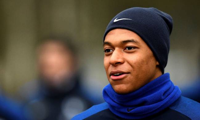 France's forward Kylian Mbappe Lottin arrives for a training session a training session in Clairefontaine.