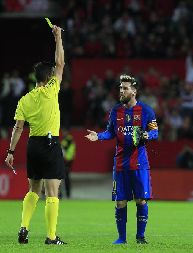 Barcelona's Messi receives yellow card.