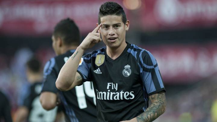 Real Madrid's Colombian midfielder James Rodriguez celebrates after scoring a goal during the Spanish league football match Granada