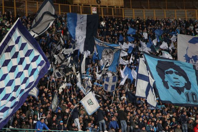 Napoli's fans cheer during the Italian Serie A football match SSC Napoli vs Juventus FC on April 2, 2017 at the San Paolo Stadium.