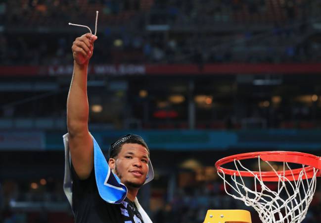 Kennedy Meeks of the North Carolina Tar Heels cuts the net after defeating the Gonzaga Bulldogs.
