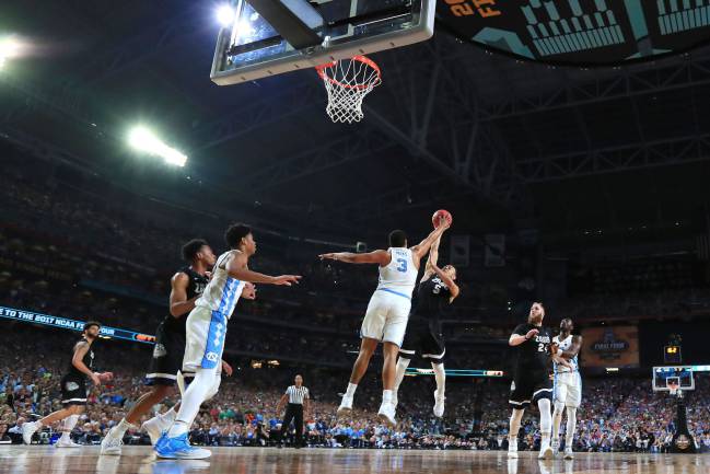 Nigel Williams-Goss of the Gonzaga Bulldogs has his shot blocked by Kennedy Meeks of the North Carolina Tar Heels.