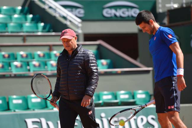 Novak Djokovic of Serbia and his coach Marian Vajda during a training session prior the 2015 French Open tennis championships