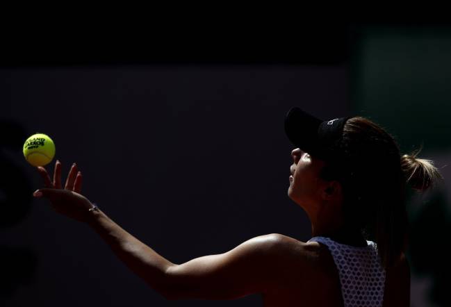 Tsvetana Pironkova serves to Mona Barthel in the French Open.