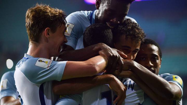 England's forward Ademola Lookman (front C) is congratulated by teammates after scoring during their U-20 World Cup round of 16 football match between England and Costa Rica
