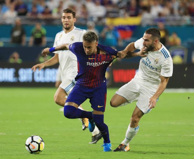 Neymar and Carvajal vie for the ball during their International Champions Cup 2017 match at Hard Rock Stadium on July 29, 2017.