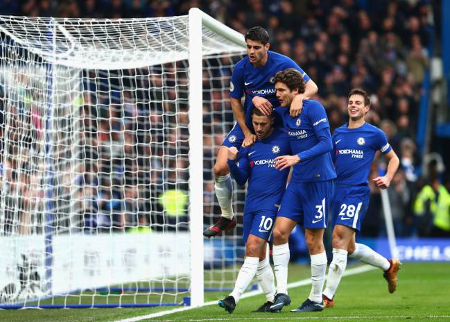 Eden Hazard celebrates after scoring his side's third goal with Alvaro Morata and Marcos Alonso during the Premier League match between Chelsea and Newcastle United at Stamford Bridge.