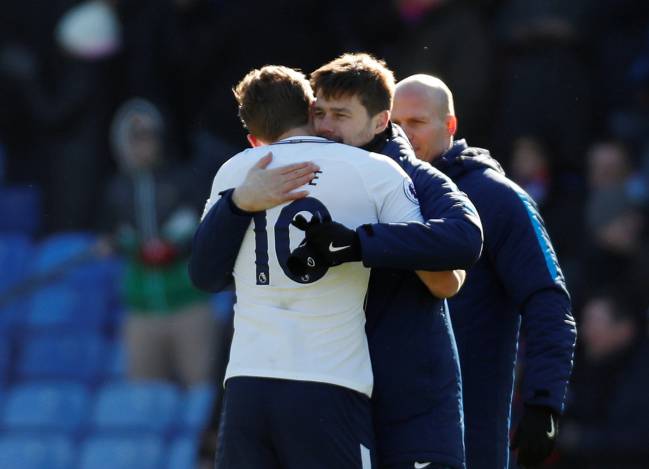 Tottenham's Harry Kane celebrates with manager Mauricio Pochettino.