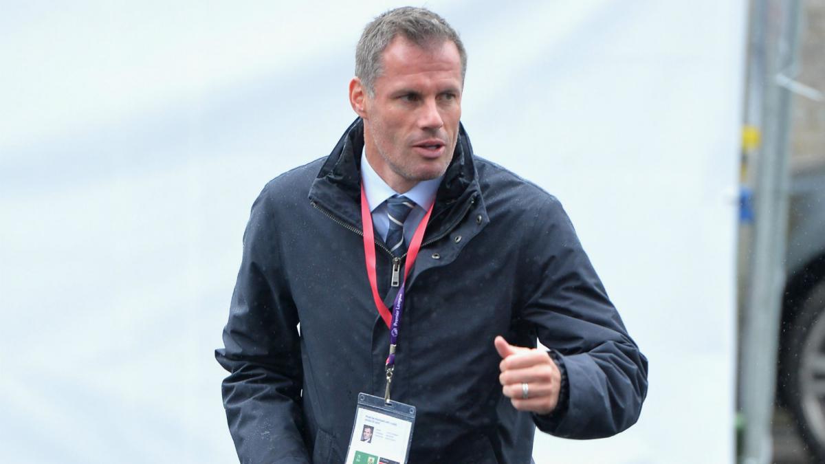 Liverpool great Carragher apologises for spitting at Man United fan
