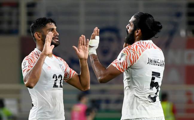 India's defender Sandesh Jhingan (R) celebrates with Anas Edathodika after win over Thailand.