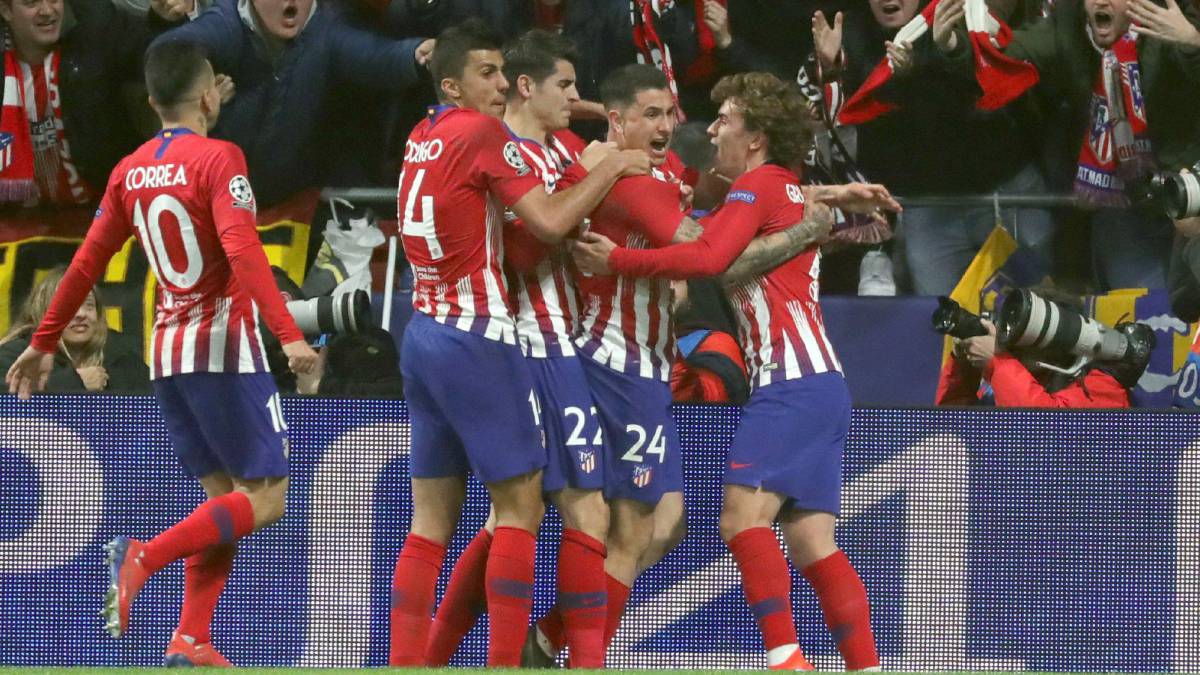 Godín seals victory for Atlético in intense encounter with Juve