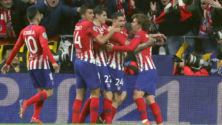 Godín seals victory for Atlético in intense encounter with Juve
