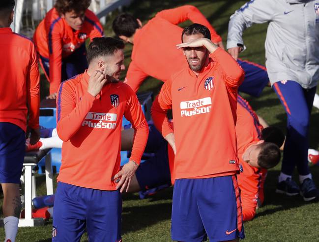 Saúl and Godin train ahead of the weekend fixture.