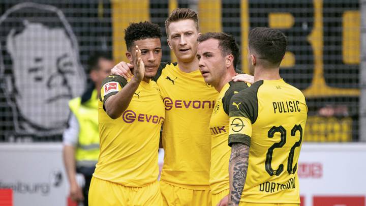 Dortmund's Jadon Sancho, Marco Reus, Mario Goetze and Christian Pulisic, celebrate their third goal during the German Bundesliga soccer match between SC Freiburg and Borussia Dortmund