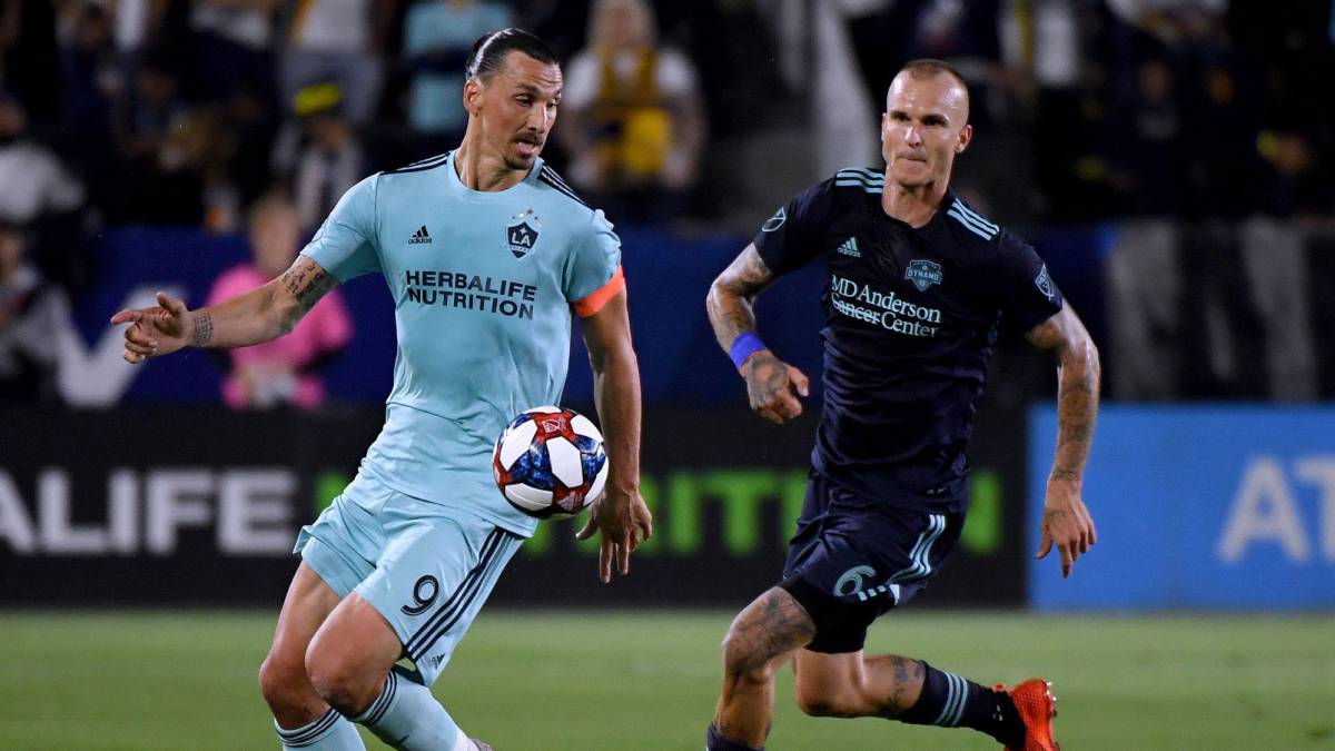 Zlatan Ibrahimovic of Los Angeles Galaxy controls the ball in front of Aljaz Struna of Houston Dynamo during the first half at Dignity Health Sports Park