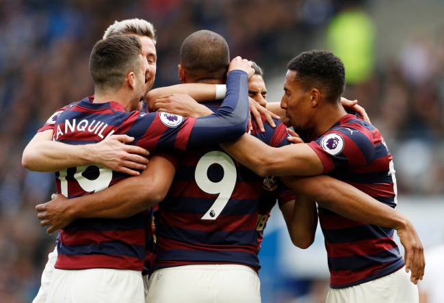 Newcastle United's Ayoze Perez celebrates scoring their first goal against Brighton with Salomon Rondon, Javier Manquillo among others.