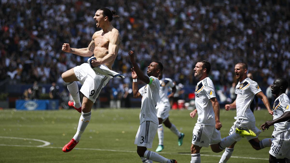 Los Angeles Galaxy's Zlatan Ibrahimovic, left, of Sweden, celebrates his goal during the second half of an MLS soccer match against the Los Angeles FC