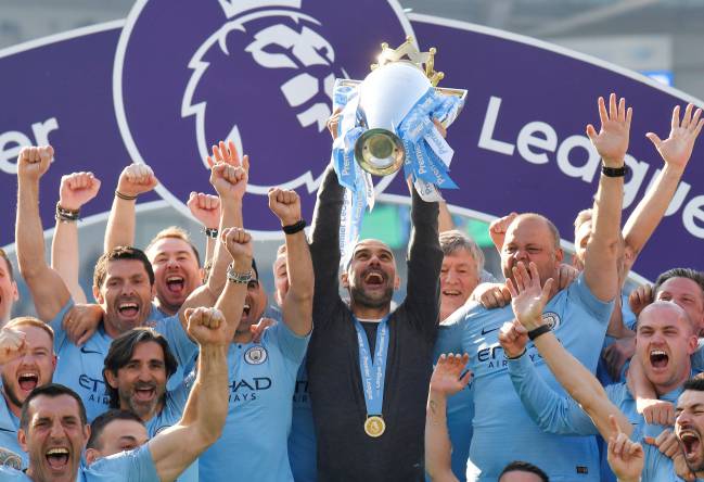 Domestic dominance | Manchester City manager Pep Guardiola lifts the Premier League trophy again.