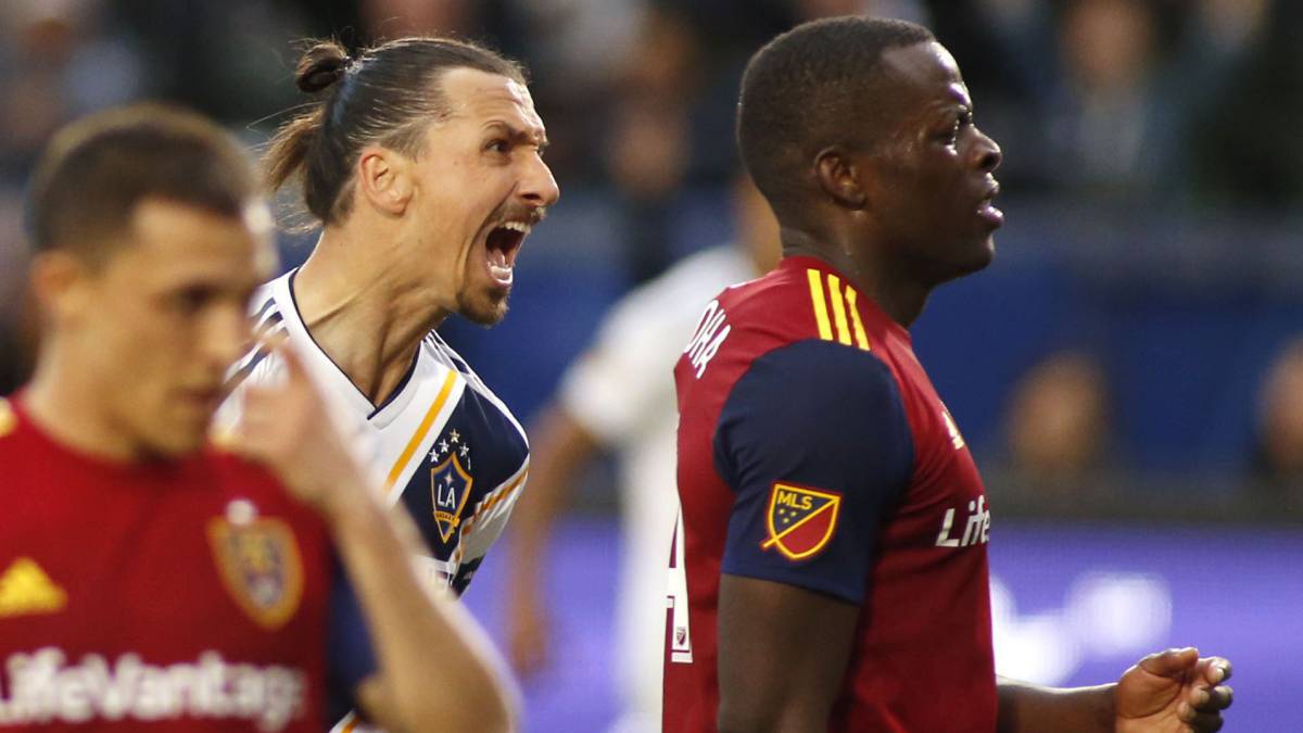 Zlatan Ibrahimovic of Los Angeles Galaxy and Nedum Onuoha of Real Salt Lake argue during the second half of a game at Dignity Health Sports Park