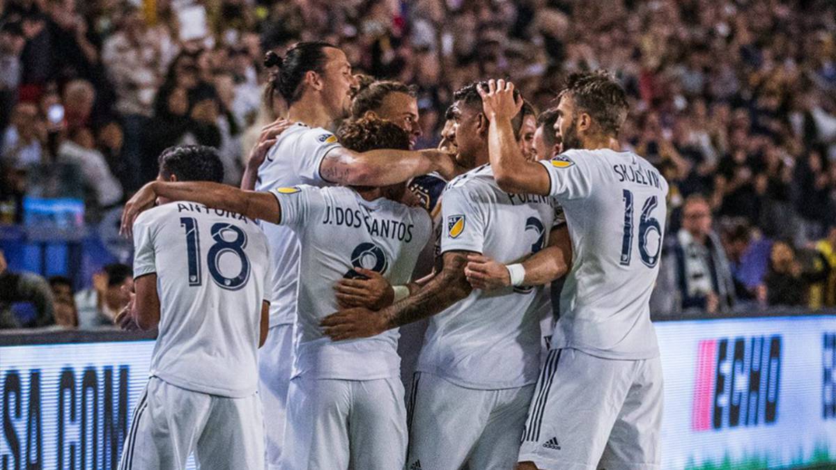 LA Galaxy players celebrating after winning against Sporting Kansas City