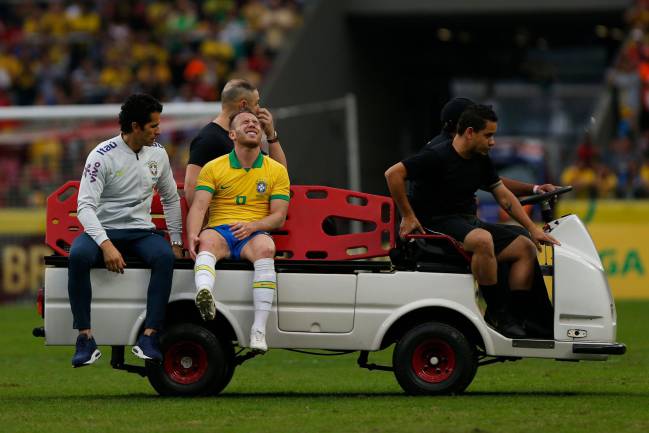 Brazil's Arthur is carried off during a friendly against Honduras at the Beira Rio Stadium in Porto Alegre.