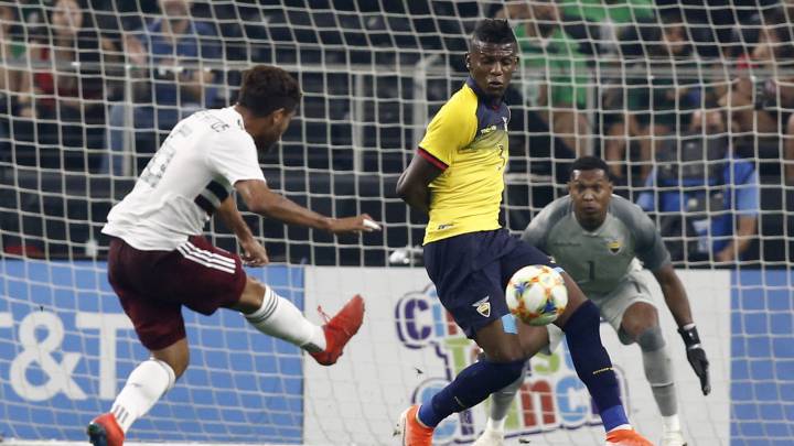 Jonathan Dos Santos of Mexico attempts to score a goal as Roberto Arboleda and goalkeeper Maximo Banguera of Ecuador defend in the first half of the international friendly soccer match between Mexico and Ecuador