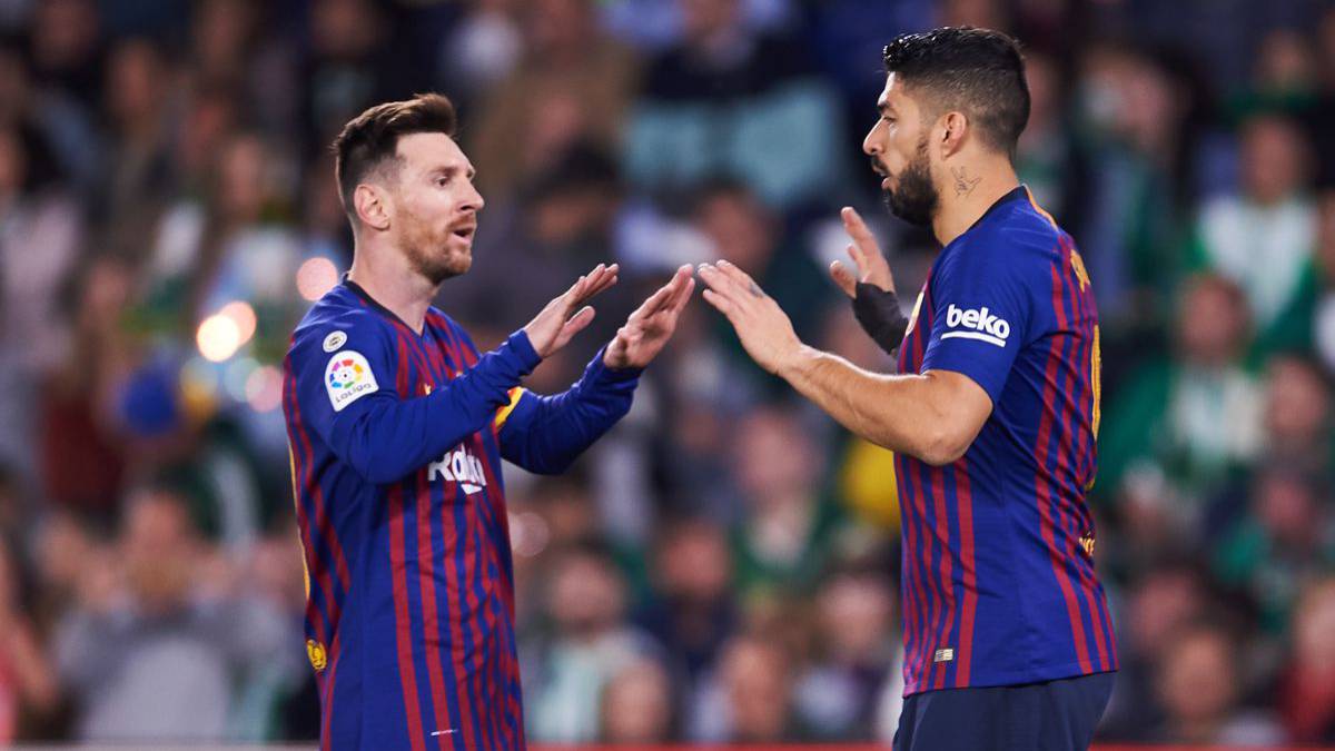 Messi and Suárez celebrating during a Champions League match