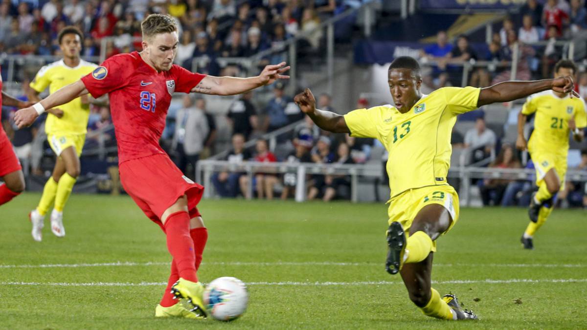 United States forward Tyler Boyd kicks a goal past Guyana defender Liam Gordon during group play in the CONCACAF Gold Cup soccer tournament at Allianz Field.