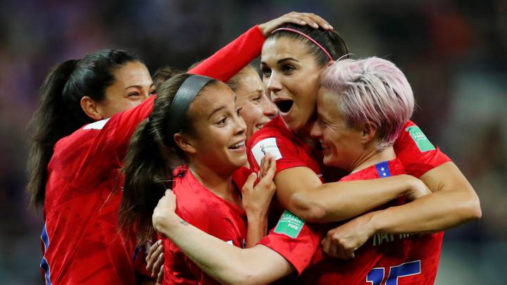 Alex Morgan of the U.S. celebrates scoring their twelfth goal with Megan Rapinoe and team mates