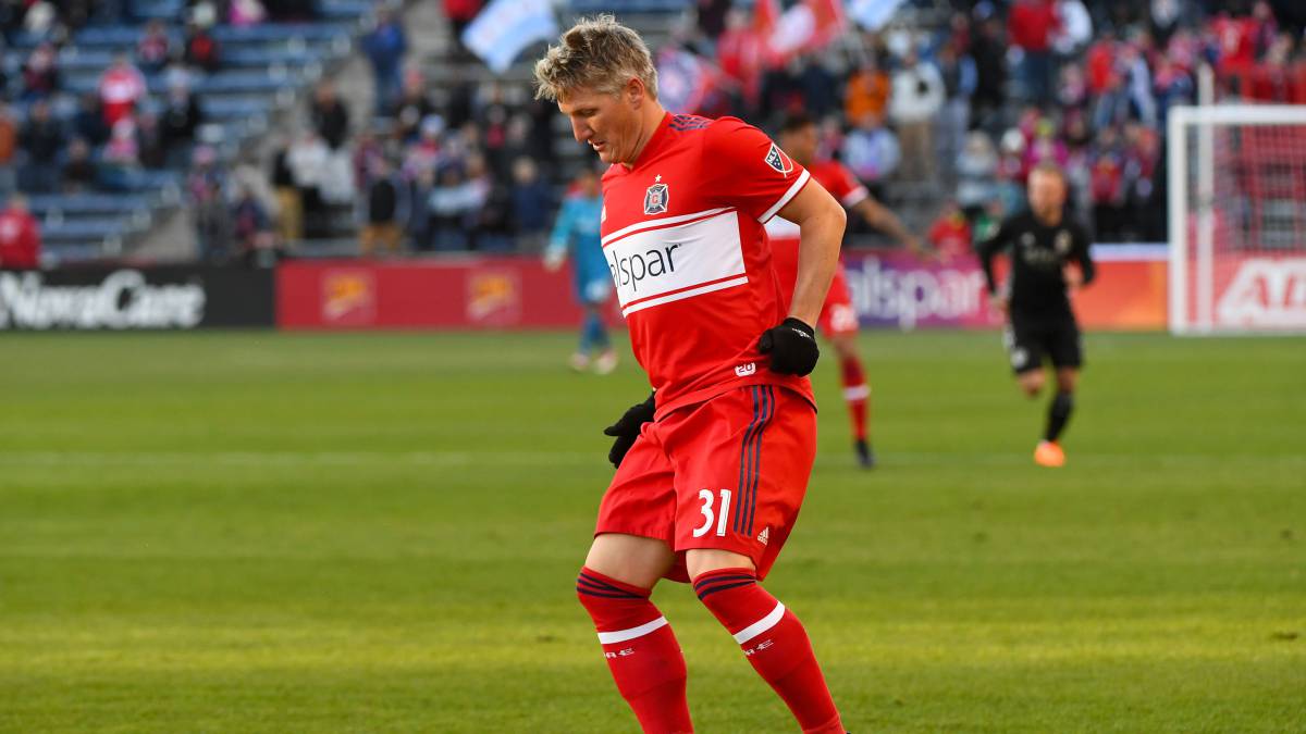 Chicago Fire midfielder Bastian Schweinsteiger kicks the ball down field against Sporting Kansas City